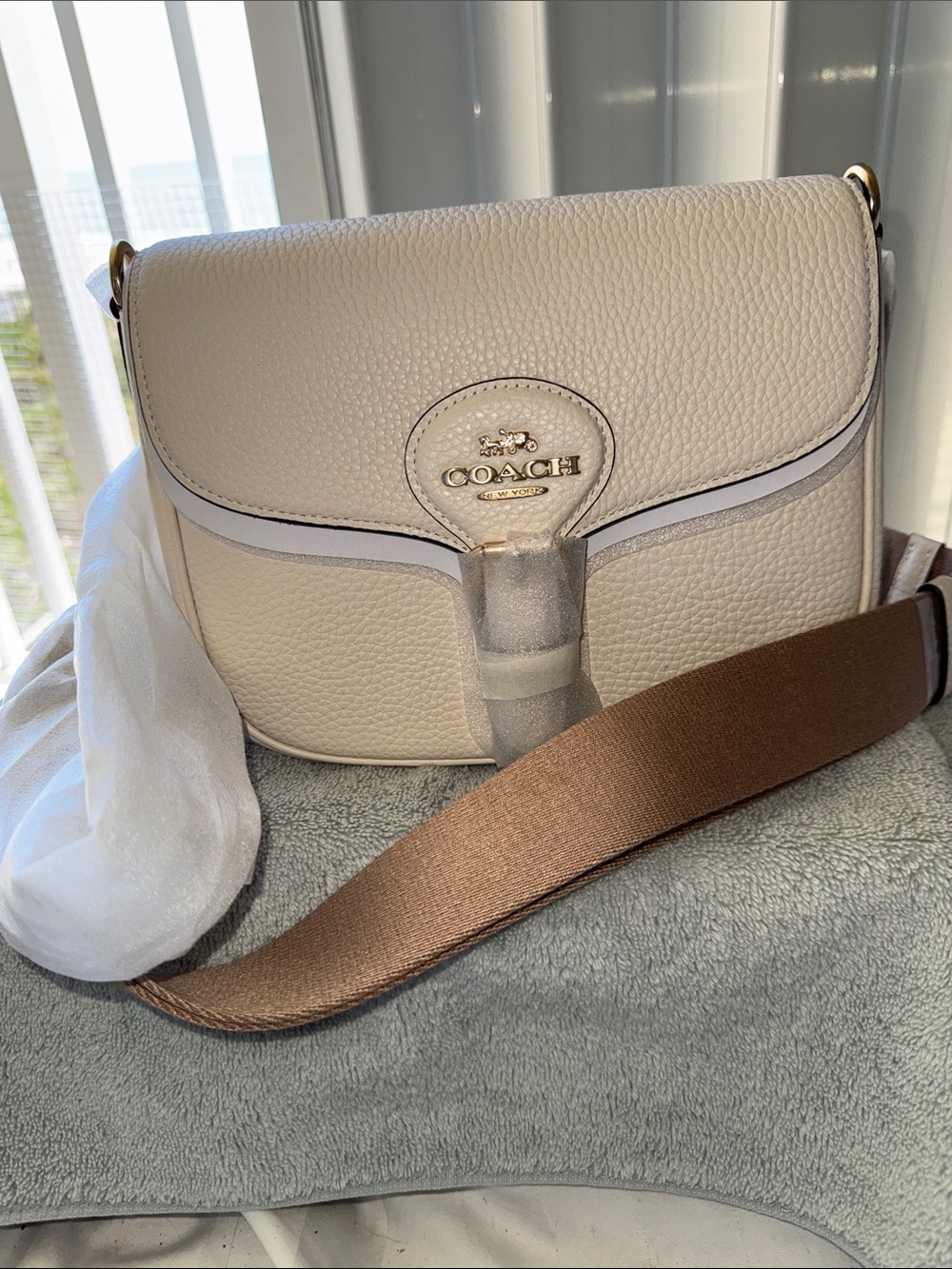 NWT - Coach Pebbled Leather Crossbody in Cream with Brown Crossover Strap.